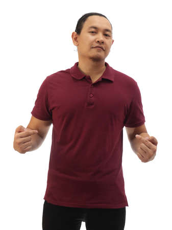 Blank collared shirt mock up template, front view, Asian male model wearing plain maroon red t-shirt and pointing himself, isolated on white. Tee design mockup presentation for printの写真素材