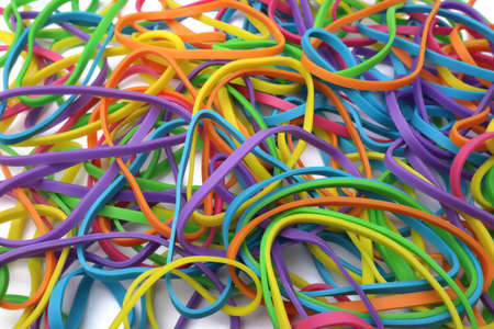 Colorful multi color elastic rubber bands texture isolated on white backgroundの写真素材