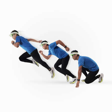 Composite image of Asian male runner from start position to run, over white backgroundの写真素材