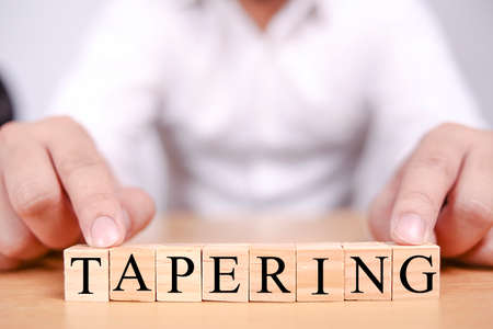 Taper Tantrum concept, global economic world market reacting to the Fed Tapering Off. Word text typographyの写真素材