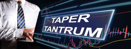 Taper Tantrum concept, global economic world market reacting to the Fed Tapering Off. Word text typographyの写真素材