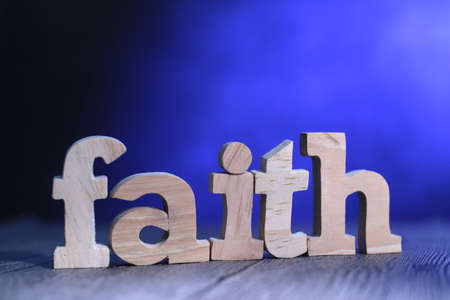 Faith, text words typography written with wooden letter on blue background, life and business motivational inspirational conceptの写真素材