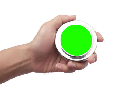 Close up of hand holding empty blank round silver metal object with green screen for copy space on white backgroundの写真素材