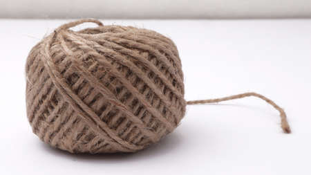 Close up of natural linen straw rope yarns isolated on white background