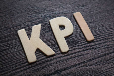 KPI Key Performance Indicator, text words typography written with wooden letter on black background, life and business motivational inspirational conceptの写真素材