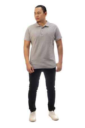 Man wearing casual grey shirt black denim and white shoes; looking to the side; front view. Full body portrait isolated cut outの写真素材