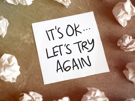 Its OK lets try again, text words typography written on paper, life and business motivational inspirational conceptの写真素材