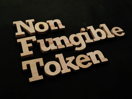 NFT Non Fungible Token, text words typography written with wooden letter, future digital asset conceptの写真素材