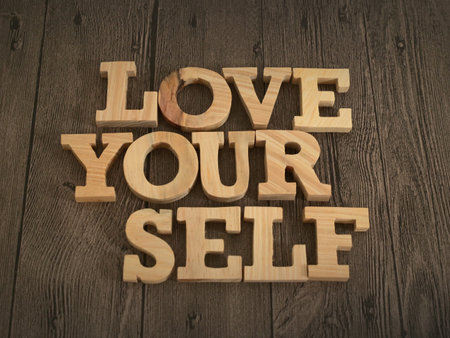 Love yourself, text words typography written with wooden letter, life and business motivational inspirational conceptの写真素材