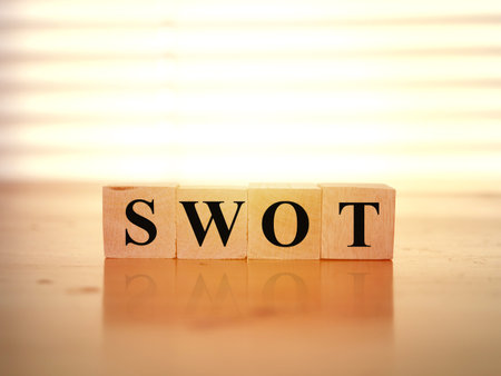 SWOT Strength Weakness Opportunity and Threats writing on wooden cube blocks, word text typography conceptの写真素材