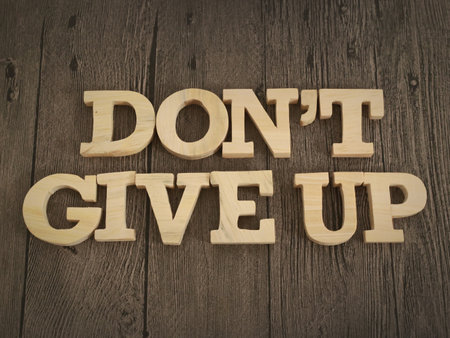 Don't give up, text words typography written with wooden letter, life and business motivational inspirational conceptの写真素材