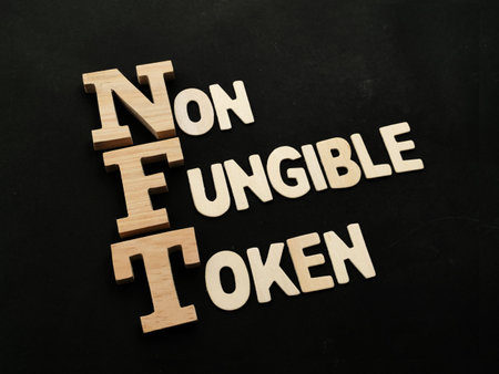 NFT Non Fungible Token, text words typography written with wooden letter, future digital asset conceptの写真素材