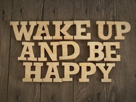 Wake up and be happy, text words typography written with wooden letter, life and business motivational inspirational conceptの写真素材