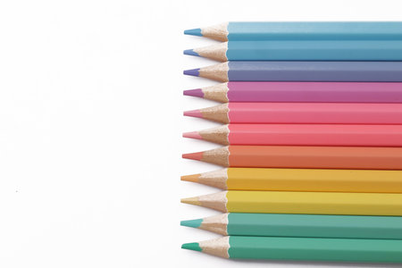Close up of colorful colored pencils art education school supplies isolated on white backgroundの写真素材