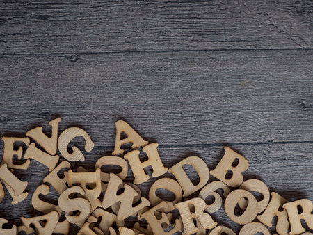 A closeup photograph of a variety of different typefaces in wooden letterpress with negative copy spaceの写真素材