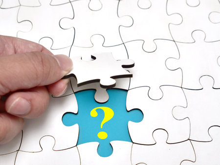 Question Mark, text words typography written under pieace of jigsaw puzzle, life and business motivational inspirational conceptの写真素材