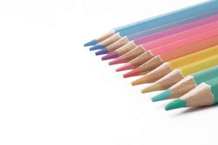 Close up of colorful colored pencils art education school supplies isolated on white backgroundの写真素材