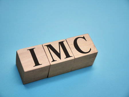 IMC integrated marketing communication, text words typography written with wooden letter, life and business motivational inspirational terms conceptの写真素材
