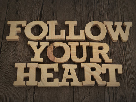 Follow your heart, text words typography written with wooden letter, life and business motivational inspirational conceptの写真素材
