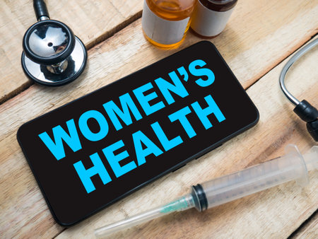 Womens health, text words typography written on smart phone, health and medical conceptの写真素材