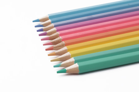 Close up of colorful colored pencils art education school supplies isolated on white backgroundの写真素材