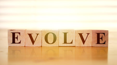 Evolve, text words typography written with wooden letter, life and business motivational inspirational conceptの写真素材