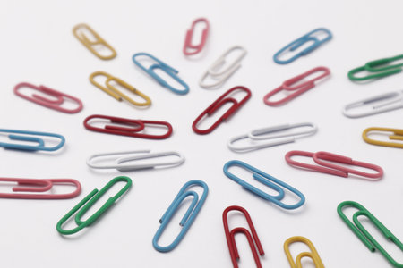 Colorful paper clip office business supplies isolated on white backgroundの写真素材