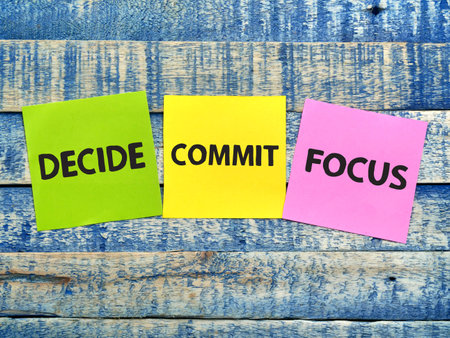 Decide commit and focus, text words typography written on paper, life and business motivational inspirational conceptの写真素材