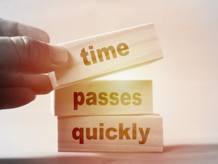 Time passes quickly, text words typography written on wooden blocks, life and self development conceptの写真素材
