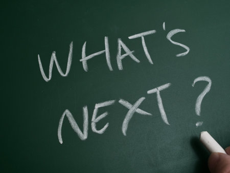 What next, text words typography written on chalkboard, life and business motivational inspirational conceptの写真素材