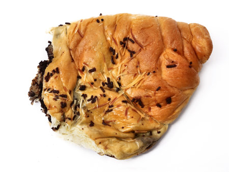 Roti sobek or kasur, soft sweet milk bun with chocolate sprinkle, isolated on white