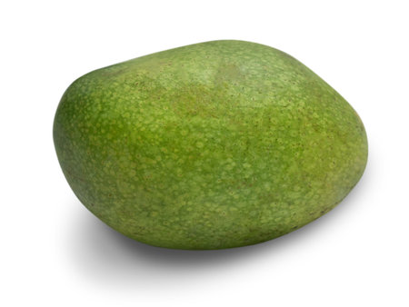 Green ripe spotted mango cut out on white background, exotic tropical fruitの写真素材