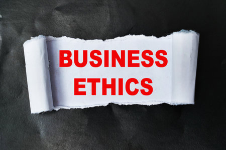 Business ethics, word text written on ripped paper, business terms conceptの写真素材