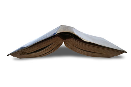 Rustic opened old book facing down on floor, cut out isolated on whiteの写真素材