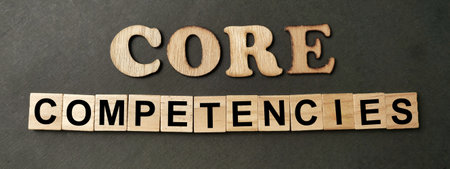 Core competencies, business term concept, text on wooden lettering
