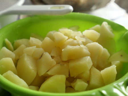 Boiling potatoes, hot cooked ingredientsの写真素材