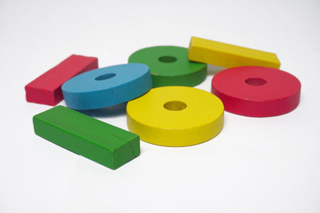 Stack of colorful wooden block toys on white background, creative fun games