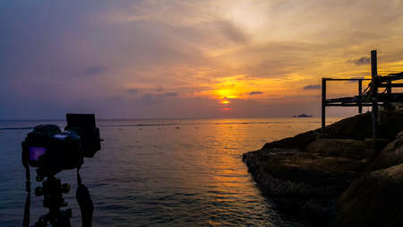 scenery of sunset at Perhentian Island with camera shooting.soft focus, blur due to long...
