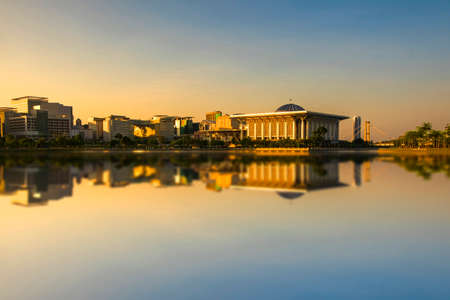 Scenery of Sunrise at 'Sultan Mizan Mosque,Putrajaya' with clear blue sky.Soft Focus,Blur due to Long Exposure. Visible Noise due to High ISO.のeditorial素材