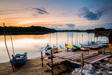 Sunrise Scenery at Lumut Bay,Perak,Malaysia with Resting Boat. Soft focus,Blur due to Long Exposure.の写真素材