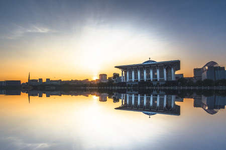 Sunrise scenery of Putrajaya Public Mosque with reflection.の写真素材