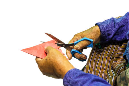 Close up shot Grandma's scissors cut paper.の写真素材