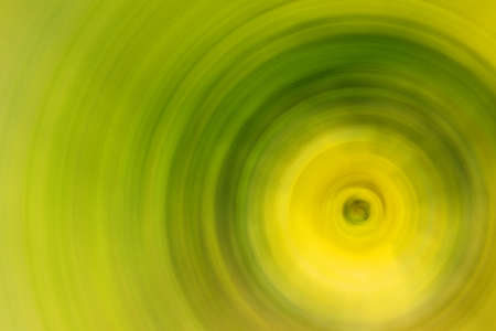 Abstract Background Of Spin Circle Radial Motion Blur in bright greenの写真素材