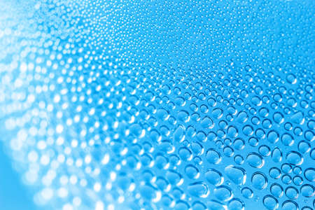 Abstract background bubbles and bokeh on blue backgroundの写真素材
