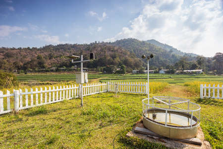 Landscape shot Weather Monitoring Stations with rice field background.の写真素材