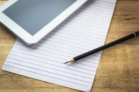 Close up shot Pencil on paper with tablet backgroundの写真素材