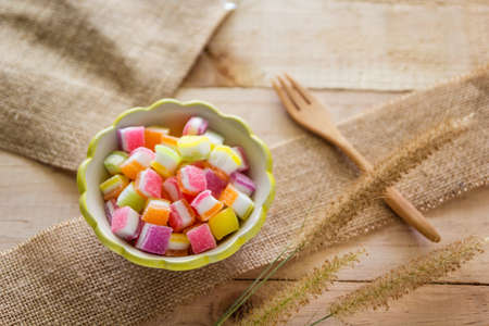 Thai dessert sugar gummy in small dish on wood boardの写真素材
