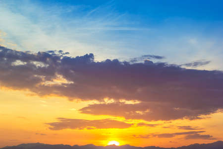 Beautiful sunrise with mountain background and cloudの写真素材