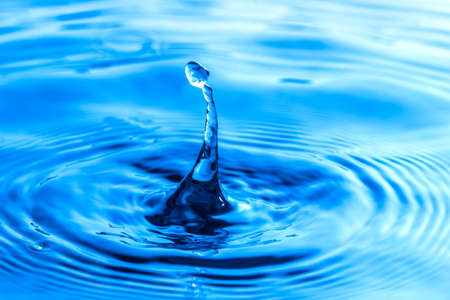 Close up shot Water drop and water rippledの写真素材