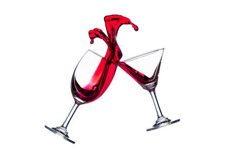 Clink red wine glasses on isolate white backgroundの写真素材